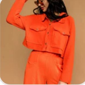 Dressed in LALA matching orange set.